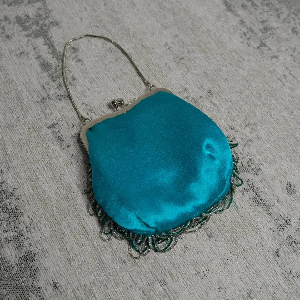 Teal siren clutch